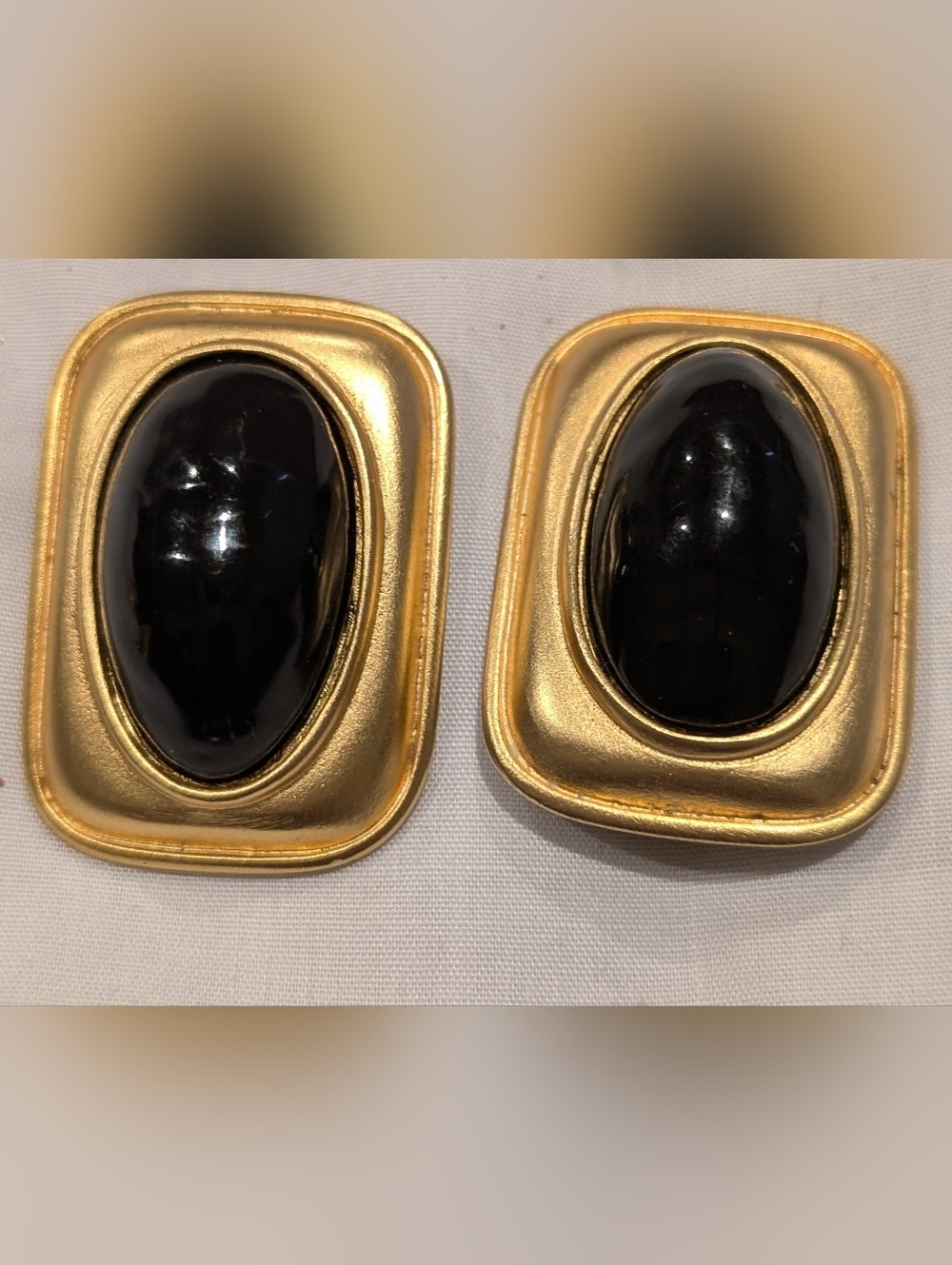 Les Bernard Gold-tone Clip Earrings with Black Cabochons